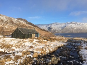 Ben Alder Cottage with Loch Ericht in the background