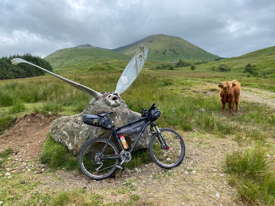 The crashed Dakota memorial just before Tomsleibhe bothy which is visible in the background